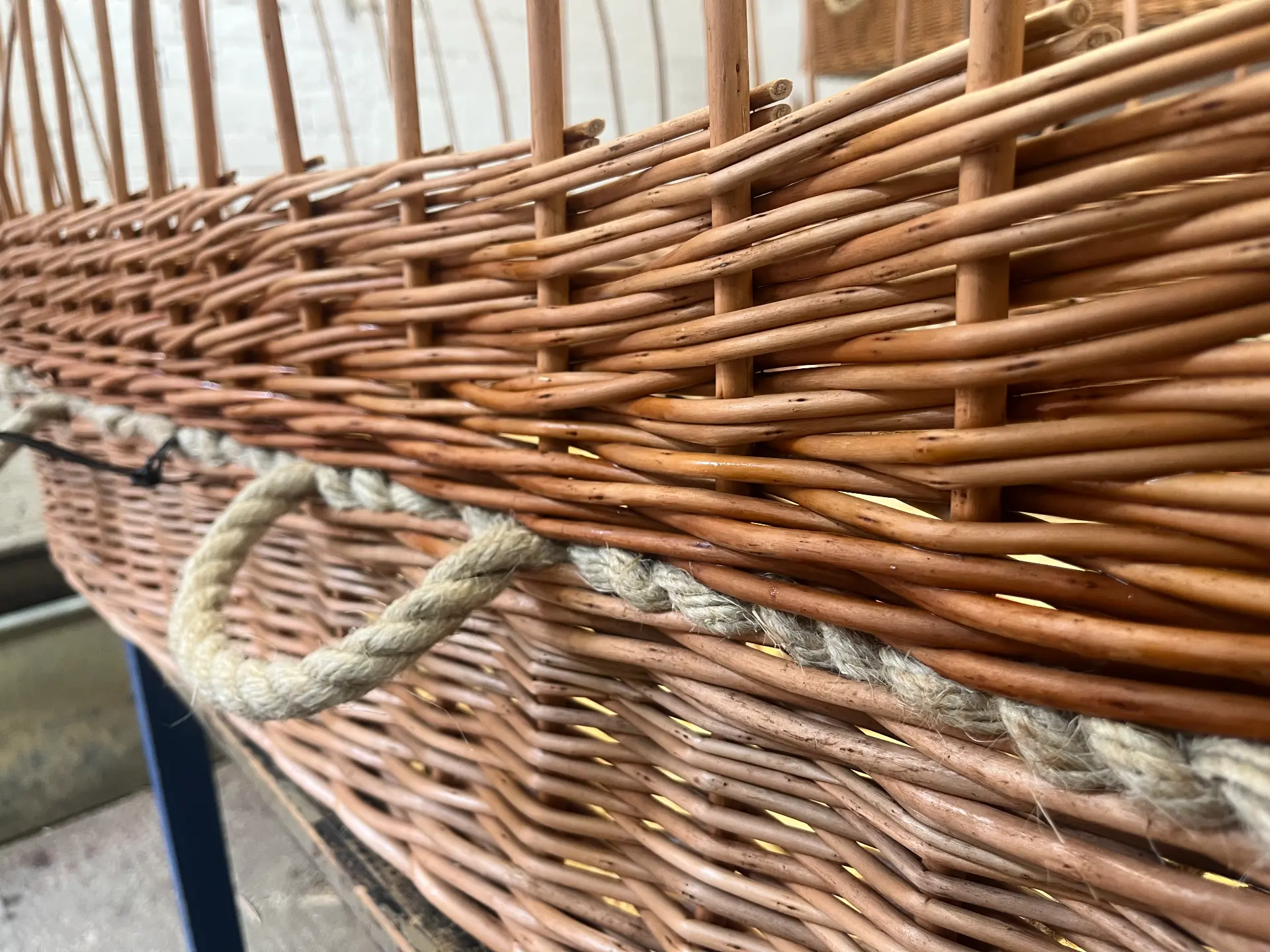 A close view of the willow weave and rope handle